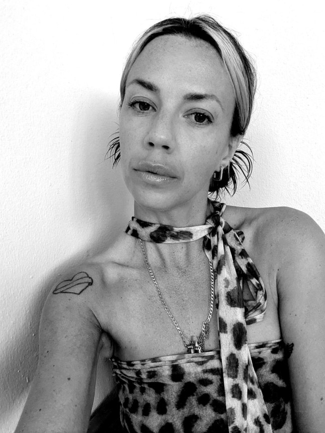 woman in animal print dress and scarf